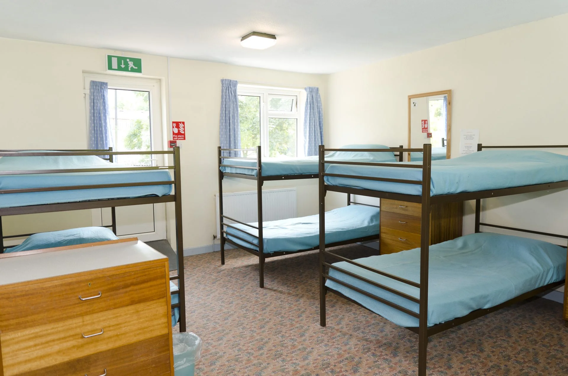 Adult-sized bunk beds in a Brecon Bunkhouse bedroom